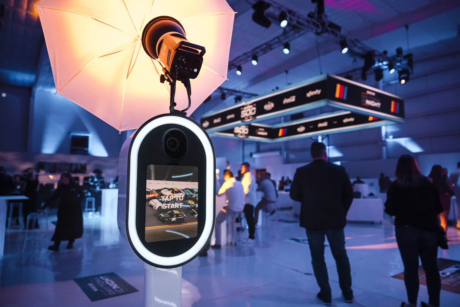Open-air photo booth activation set up on the floor of a corporate event in Orlando